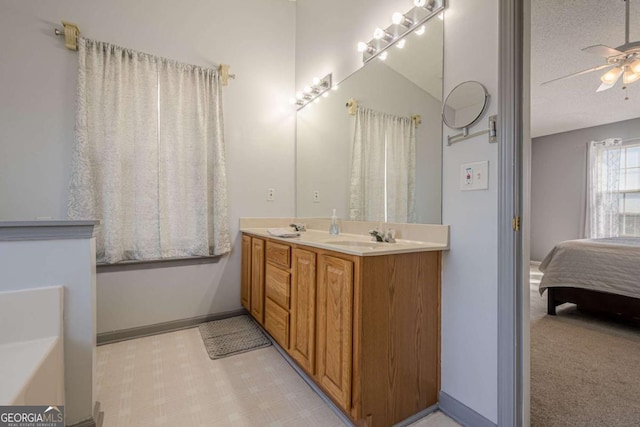 bathroom with vanity and ceiling fan