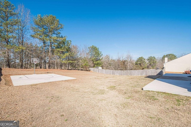 view of yard with basketball court