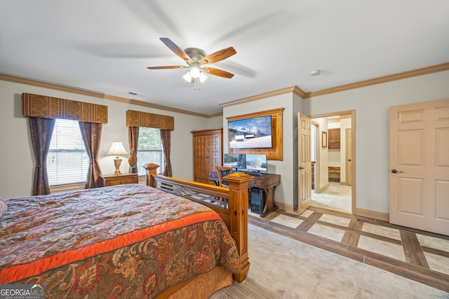 bedroom with crown molding, a ceiling fan, visible vents, and baseboards