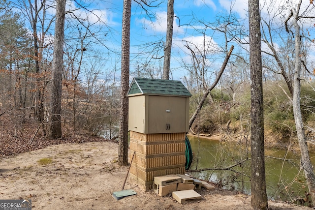 view of outdoor structure with a water view