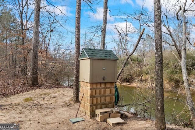 view of shed featuring a water view