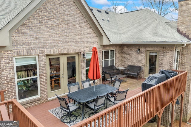 deck with outdoor dining space