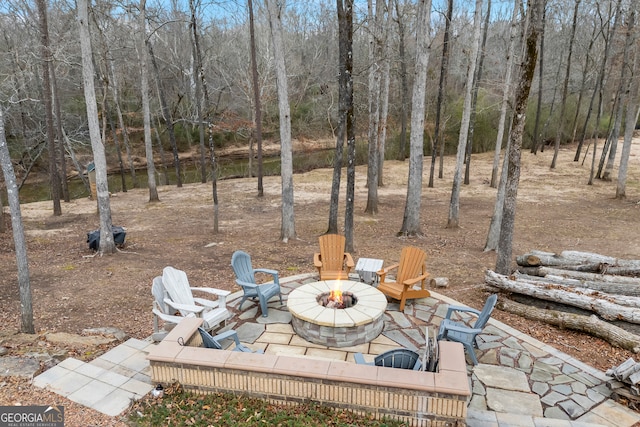 view of patio / terrace with a fire pit