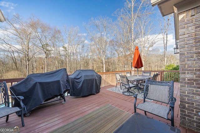 wooden deck featuring grilling area