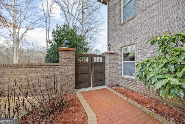 view of gate featuring fence