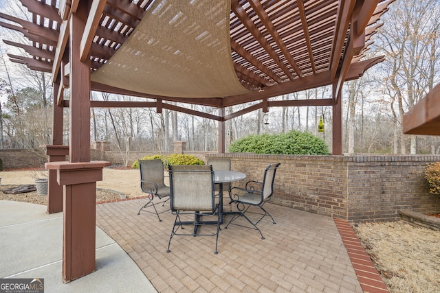 view of patio / terrace with a pergola and outdoor dining space