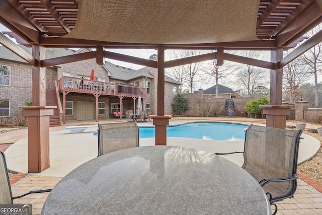 view of pool featuring a pergola, a patio, and a deck