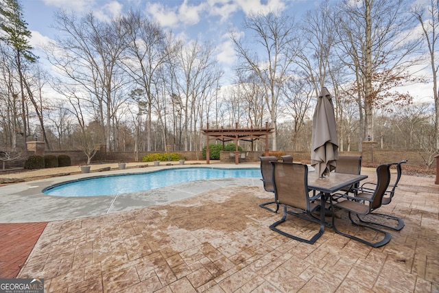 pool with a gazebo, a patio area, and a fireplace