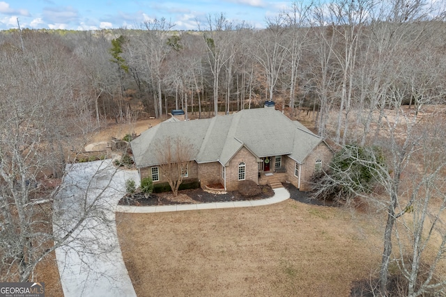 drone / aerial view with a view of trees