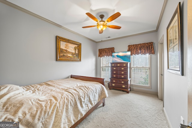 bedroom featuring crown molding, ceiling fan, and carpet flooring