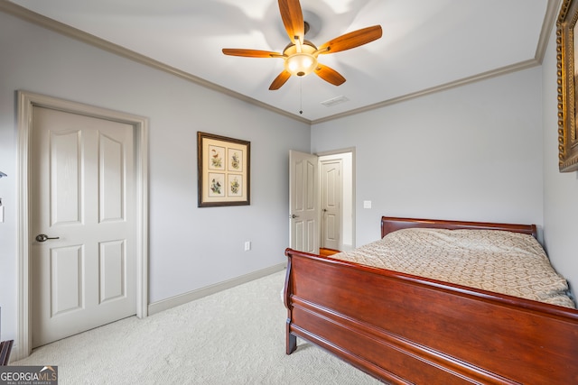 bedroom with light carpet, a ceiling fan, baseboards, and crown molding