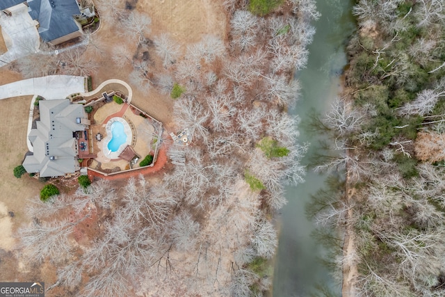 birds eye view of property featuring a water view