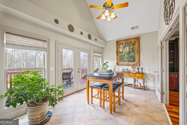 dining space featuring a wealth of natural light, high vaulted ceiling, french doors, and ceiling fan