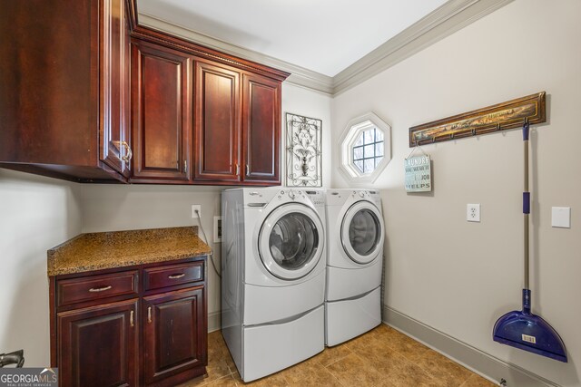 clothes washing area featuring crown molding, cabinets, separate washer and dryer, and light tile patterned floors