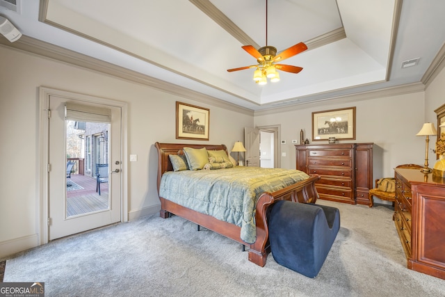 bedroom featuring light carpet, access to exterior, a raised ceiling, and crown molding
