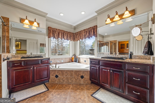 bathroom featuring tile patterned floors, ornamental molding, separate shower and tub, and vanity