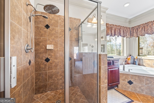 bathroom featuring crown molding and separate shower and tub