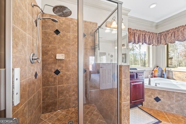 full bathroom with ornamental molding, a shower stall, and a bath