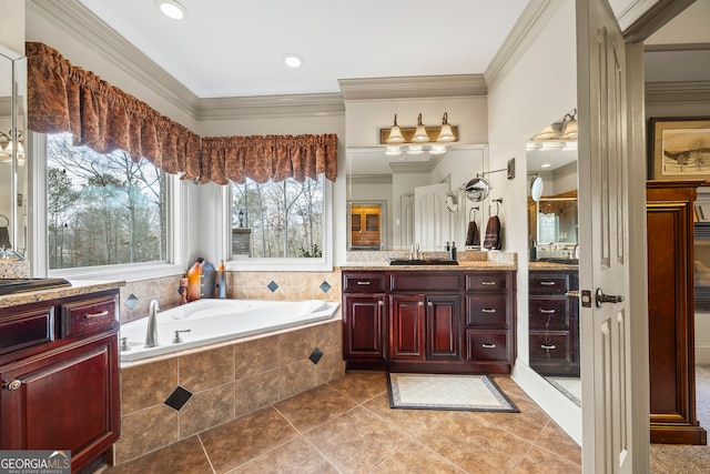 bathroom featuring ornamental molding, a relaxing tiled tub, vanity, and tile patterned floors