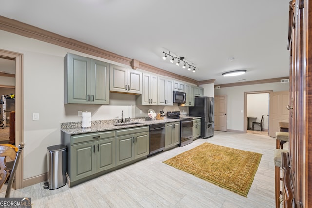 kitchen featuring baseboards, visible vents, appliances with stainless steel finishes, ornamental molding, and a sink