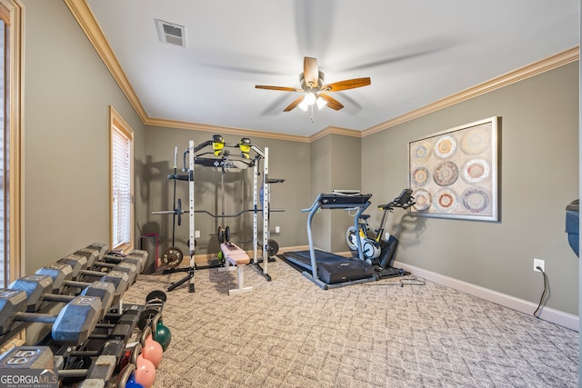 exercise room featuring crown molding, carpet flooring, and ceiling fan