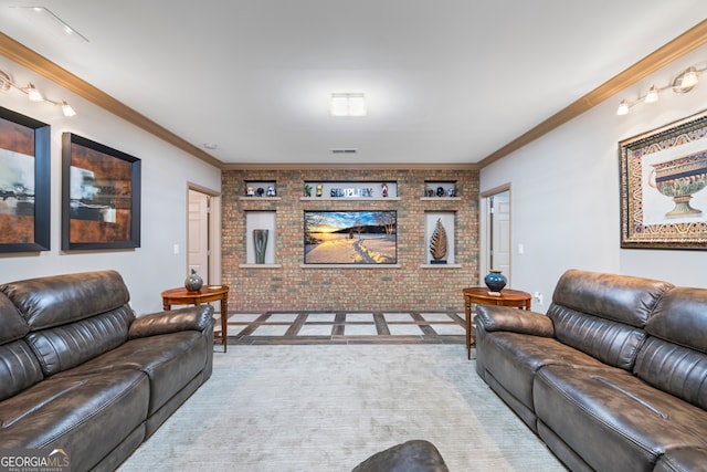 living room with brick wall, crown molding, and carpet