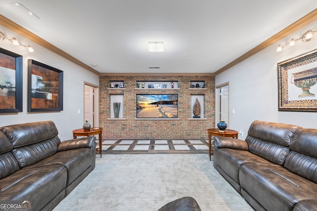 carpeted living room with visible vents, crown molding, and brick wall
