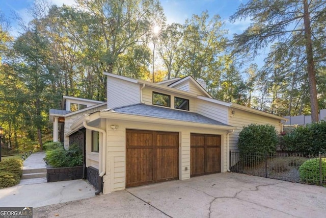 view of side of home with a garage