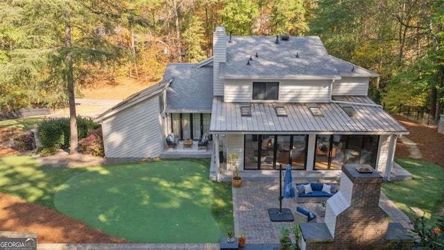 exterior space featuring a yard, outdoor lounge area, and a patio area