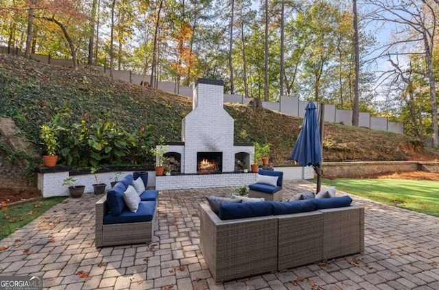 view of patio / terrace featuring an outdoor living space with a fireplace