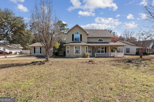 view of front of house with covered porch and a front lawn