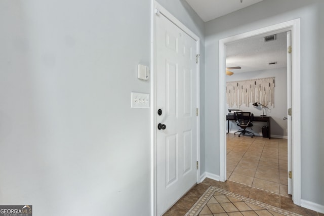 doorway to outside featuring tile patterned floors