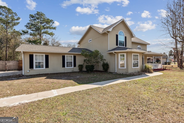 front facade with a front yard and a porch