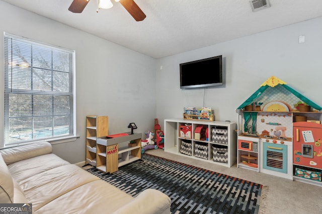 rec room featuring ceiling fan and carpet flooring