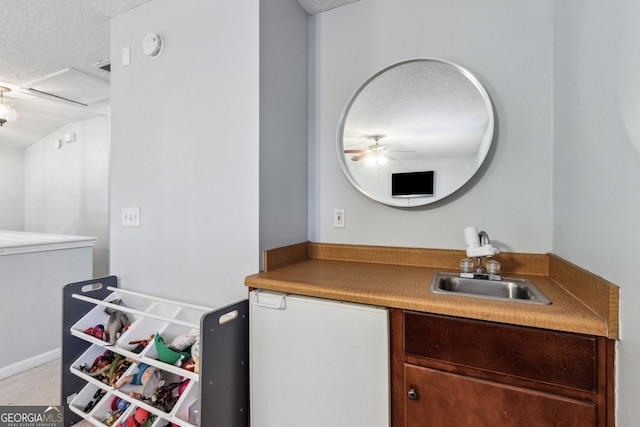 bathroom with sink and a textured ceiling