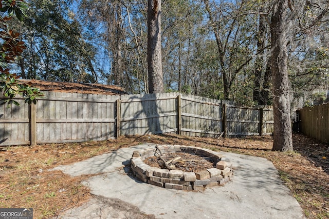 view of patio / terrace with a fire pit