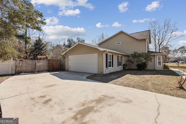 view of side of property with a garage