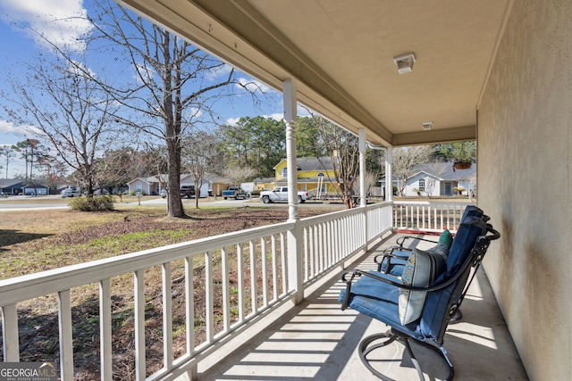 balcony featuring covered porch