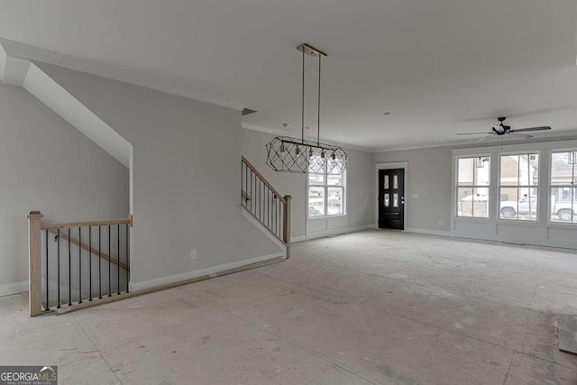 unfurnished living room with stairs, crown molding, baseboards, and a ceiling fan