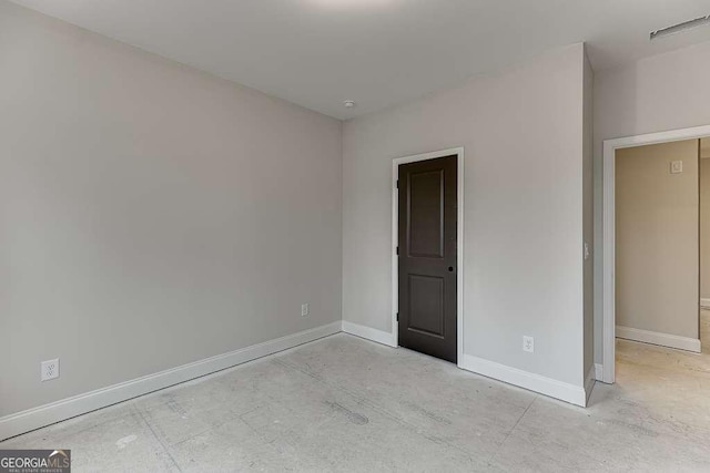 unfurnished bedroom with baseboards