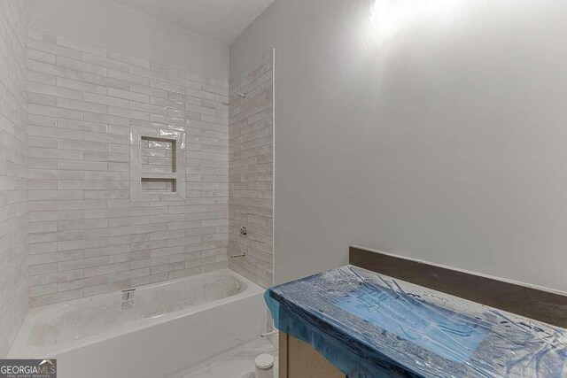 bathroom featuring washtub / shower combination