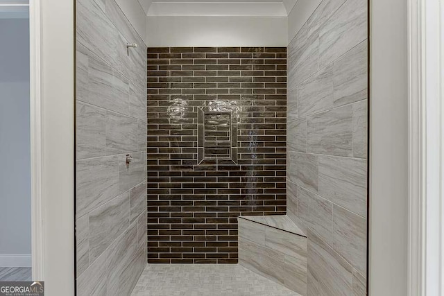 bathroom with tiled shower