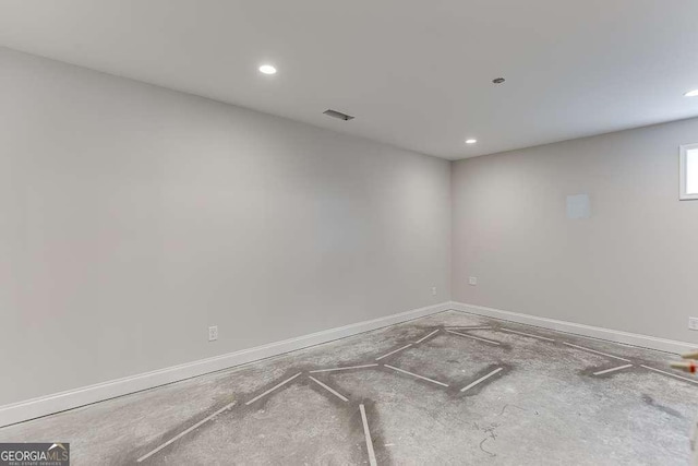 spare room featuring recessed lighting, baseboards, and visible vents