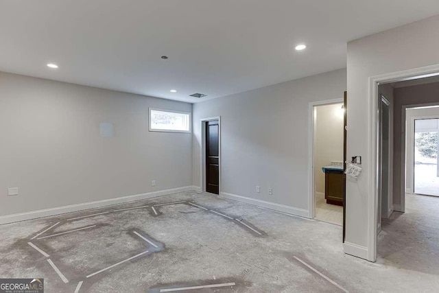 interior space with recessed lighting, visible vents, and baseboards