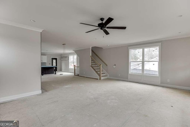 unfurnished living room featuring stairway, baseboards, a ceiling fan, and crown molding