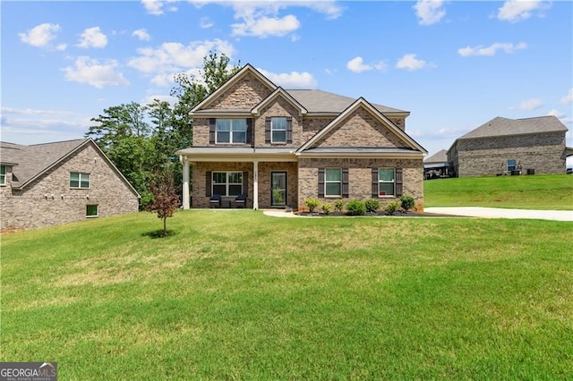 craftsman house featuring a front yard and covered porch