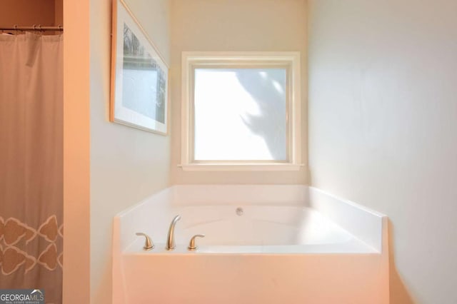 bathroom featuring a tub to relax in