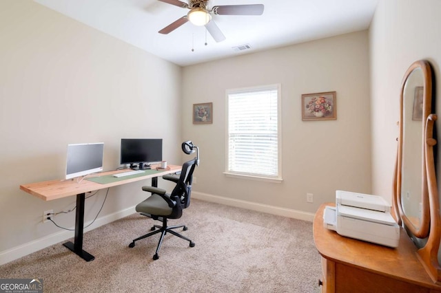 carpeted office with ceiling fan