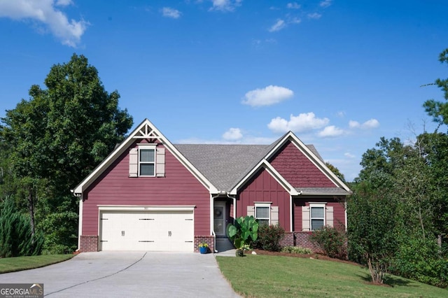 craftsman house featuring a garage and a front yard