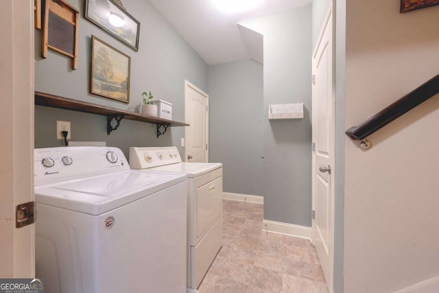 clothes washing area featuring washer and dryer